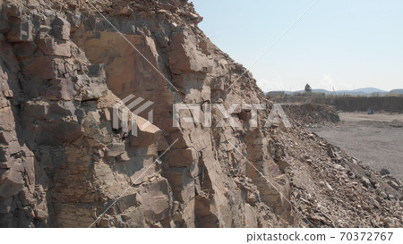 Close view of rocky soil structure in a mining quarry. Close view of rocky soil structure in a mining quarry. 70372767