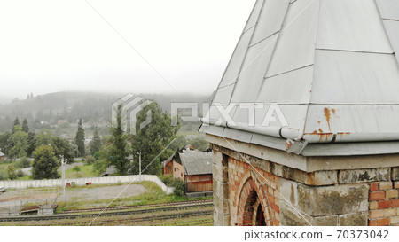 Piece of chapel building in the foreground. 70373042