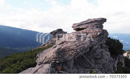 Close view of mountain boulders. 70373305