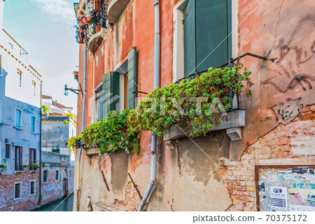 Typical window in a house in old Europe Typical window in a house in old Europe 70375172