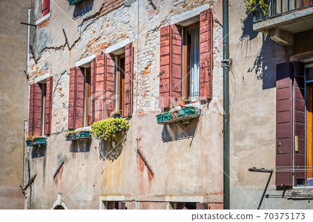 Typical window in a house in old Europe Typical window in a house in old Europe 70375173