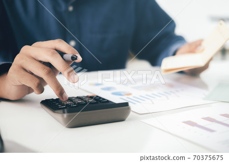 Accountant or banker calculate the cash bill. Accountant or banker calculate the cash bill. 70375675