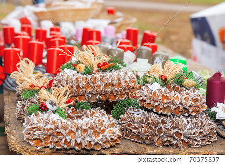 Natural advent beechnut wrethe. Christmas decorations at the Advent street market. 70375837
