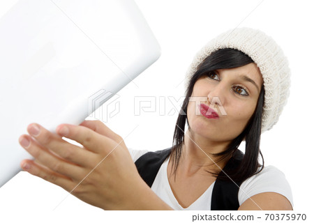 young woman with a tablet makes a selfie, on white young woman with a tablet makes a selfie, on white 70375970
