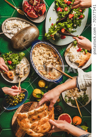 Flat-lay of people having Turkish style dinner Flat-lay of people having Turkish style dinner 70377541