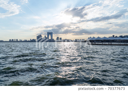 City buildings by Jinji Lake in Suzhou, China. 70377673