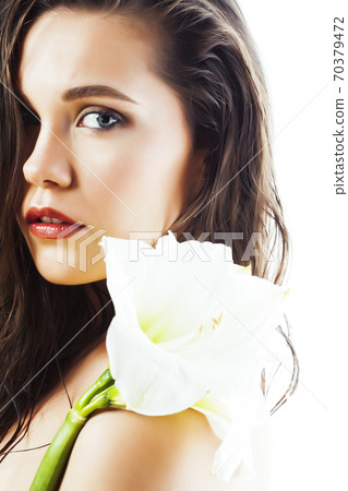 young pretty woman with Amarilis flower closeup isolated on white macro 70379472