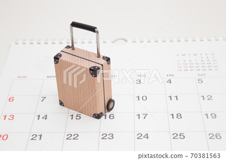 Suitcase and calendar travel image Suitcase and calendar travel image 70381563