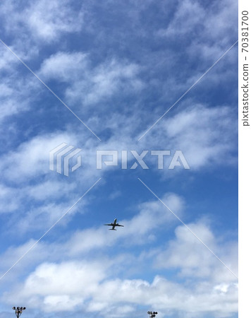 An airplane flying in the clear sky An airplane flying in the clear sky 70381700