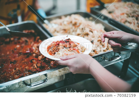Concept of free food serving Concept of free food serving 70382159