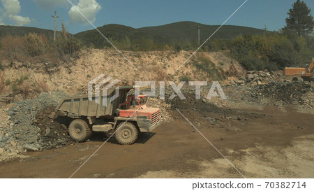 Big orange dusty truck. Big orange dusty truck. 70382714