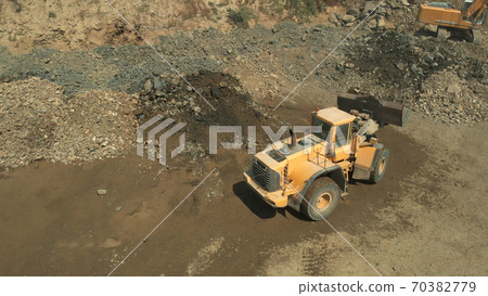 Earthmoving machine for excavation and dumping of soil. 70382779