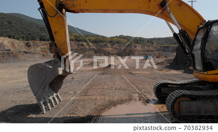 Earthmoving machine for excavation and dumping. 70382934