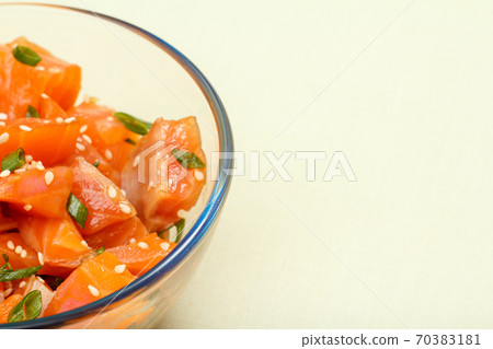 Hawaiian salmon poke with green onions and sesame seeds 70383181