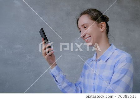 Woman using smartphone, having video chat, interview or consultation Woman using smartphone, having video chat, interview or consultation 70385515