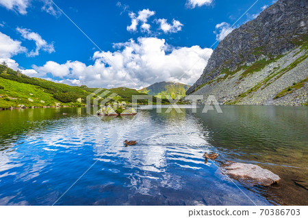 Mountain lake in Rohace area of the Tatra National Park, Slovaki Mountain lake in Rohace area of the Tatra National Park, Slovaki 70386703