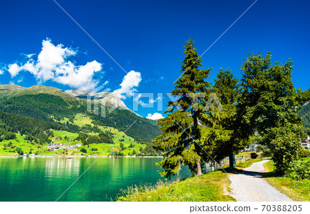 Road at Lake Reschen in Italian Alps 70388205