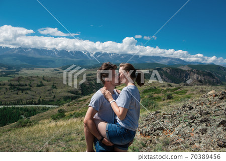 Loving couple together on mountain Loving couple together on mountain 70389456