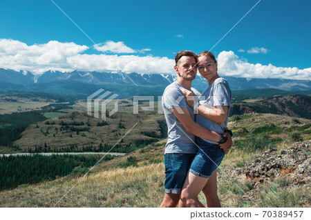 Loving couple together on mountain 70389457