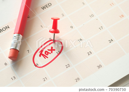 tax day concept with red circle on calendar date tax day concept with red circle on calendar date 70390730