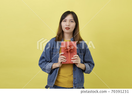 Portrait beautiful young asian woman with red gift box Portrait beautiful young asian woman with red gift box 70391231
