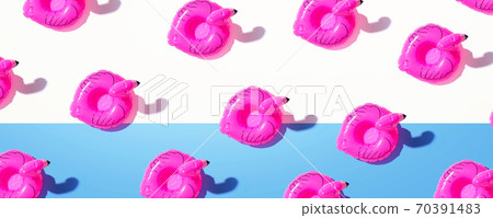 Summer concept with pink flamingo floats Summer concept with pink flamingo floats 70391483
