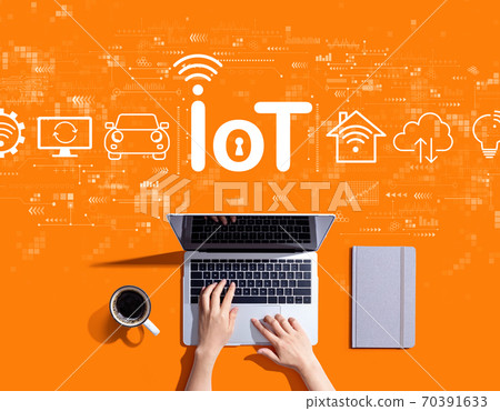 IoT theme with person using a laptop IoT theme with person using a laptop 70391633