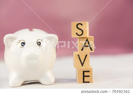 White Piggy bank and wood word save money in the future for family background White Piggy bank and wood word save money in the future for family background 70392162