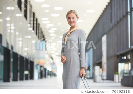 Smiling Flight Attendant in Airport Smiling Flight Attendant in Airport 70392518