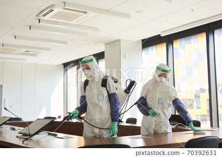 Two People Disinfecting Office Two People Disinfecting Office 70392631