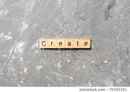 create word written on wood block. create text on table, concept 70393381