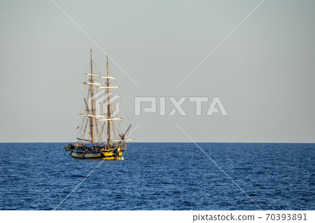 Old vessel sail ship in open sea Old vessel sail ship in open sea 70393891