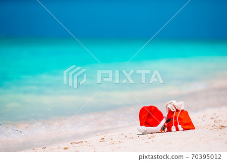 accessories with Santa Hat on white tropical beach accessories with Santa Hat on white tropical beach 70395012