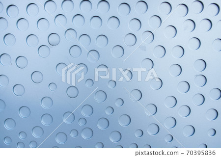 Matte metal surface with stamped round not through holes. 70395836
