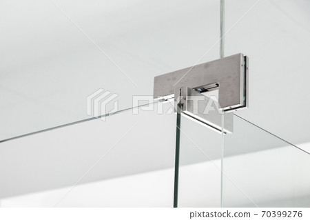 glass door hinges to bathroom, close up of hinged accessories of transparent partitions on the white wall with copy space. 70399276