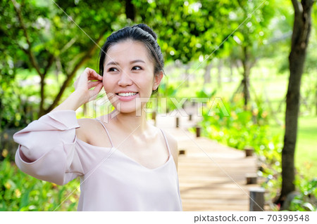 Portrait young woman smiling in the nature Portrait young woman smiling in the nature 70399548
