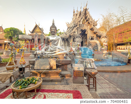 Chiang Mai, Thailand - Mar 17, 2019: Wat Sri Suphan is also known as the Silver Temple because of its impressive hand crafted silver decoration. Chiang Mai, Thailand - Mar 17, 2019: Wat Sri Suphan is also known as the Silver Temple because of its impressive hand crafted silver decoration. 70400481