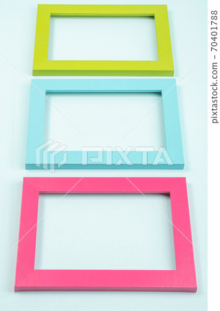 Creative layout made of three bright colored frames on blue background. Flat lay Top view Copy space Mockup 70401788