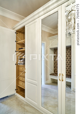 White wardrobe with wooden drawers and shelves. Wooden filling of wardrobe White wardrobe with wooden drawers and shelves. Wooden filling of wardrobe 70404775