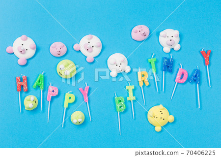 multicolored marshmallows in the form of little animals scattered on a blue background, an inscription birthday from candles, a merry holiday multicolored marshmallows in the form of little animals scattered on a blue background, an inscription birthday from candles, a merry holiday 70406225