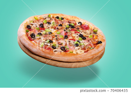 Italian pizza hovering in the air with bacon, olives and sweet peppers, on a pastel green background, concept Italian pizza hovering in the air with bacon, olives and sweet peppers, on a pastel green background, concept 70406435