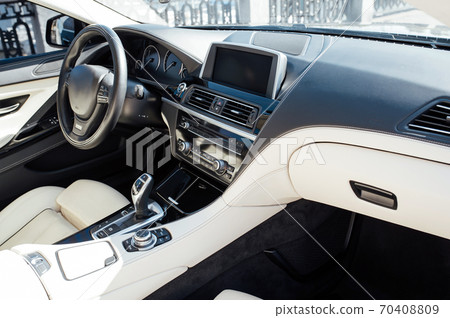Car inside driver place. Interior of prestige modern car. Front seats with steering wheel Car inside driver place. Interior of prestige modern car. Front seats with steering wheel 70408809