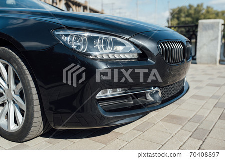 close up view of the front light in a luxury car close up view of the front light in a luxury car 70408897