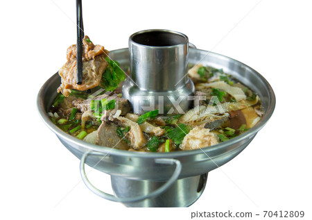 Chinese clear soup Stewed beef offal in hot pot focus selective. 70412809