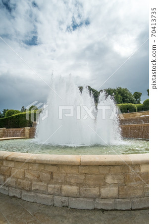 Fountain in The Alnwick Garden, a complex of formal gardens adjacent to Alnwick Castle in the town of Alnwick, Northumberland, England 70413735