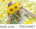 Play with sunflowers 70414467