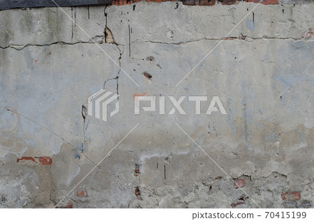 old grey concrete garage wall with red bricks and cracks abstract background old grey concrete garage wall with red bricks and cracks abstract background 70415199
