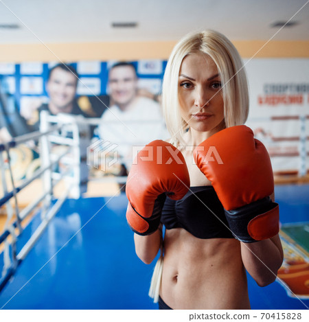 Pretty sport woman with boxing gloves Pretty sport woman with boxing gloves 70415828