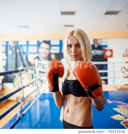 Pretty sport woman with boxing gloves 70415838