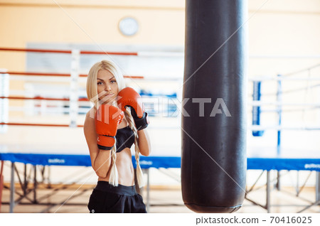Pretty sport woman with boxing gloves 70416025
